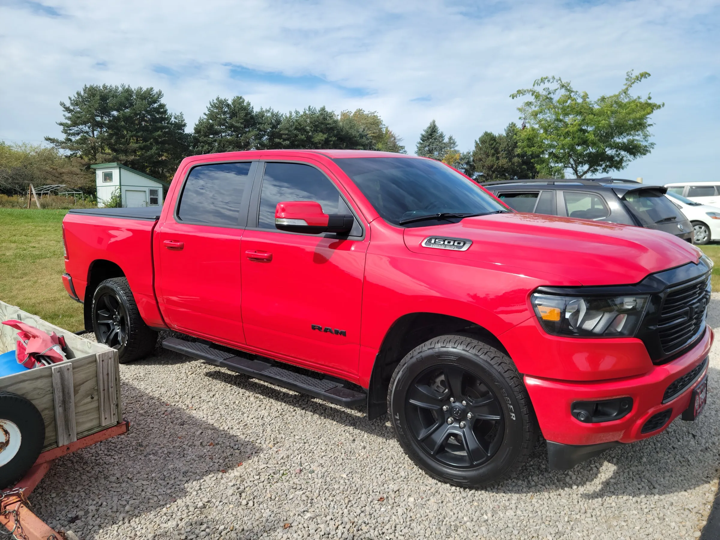 Red RAM 1500 Sport with tinted side and rear glass